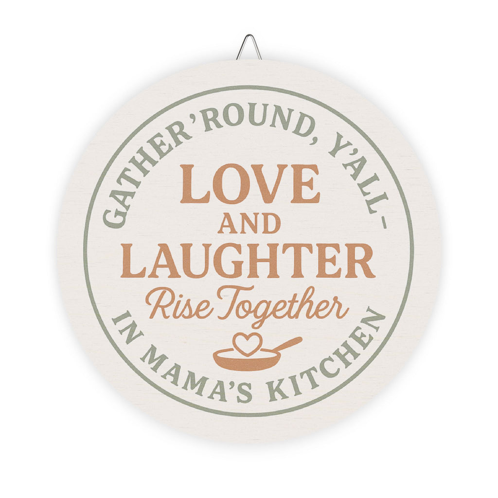 Decorative wall hanging with text 'Gather 'round, y'all. Love and laughter rise together in mama's kitchen' on a white background.