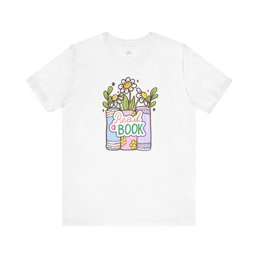Whimsical Reading Tee, Cute Book Lover Shirt, Gift for Readers, Flower Graphic Tee, Summer Casual Wear, Literary Lover T-shirt